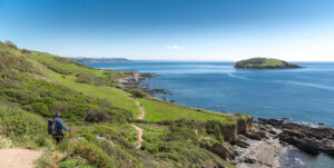 Walkers on the Looe to Polperro section of the South West Coast Path