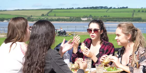 Young people eating lunch at Fremington Quay Cafe