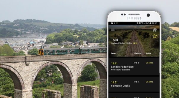 Cornwall app shown on phone against backdrop of local rail scene