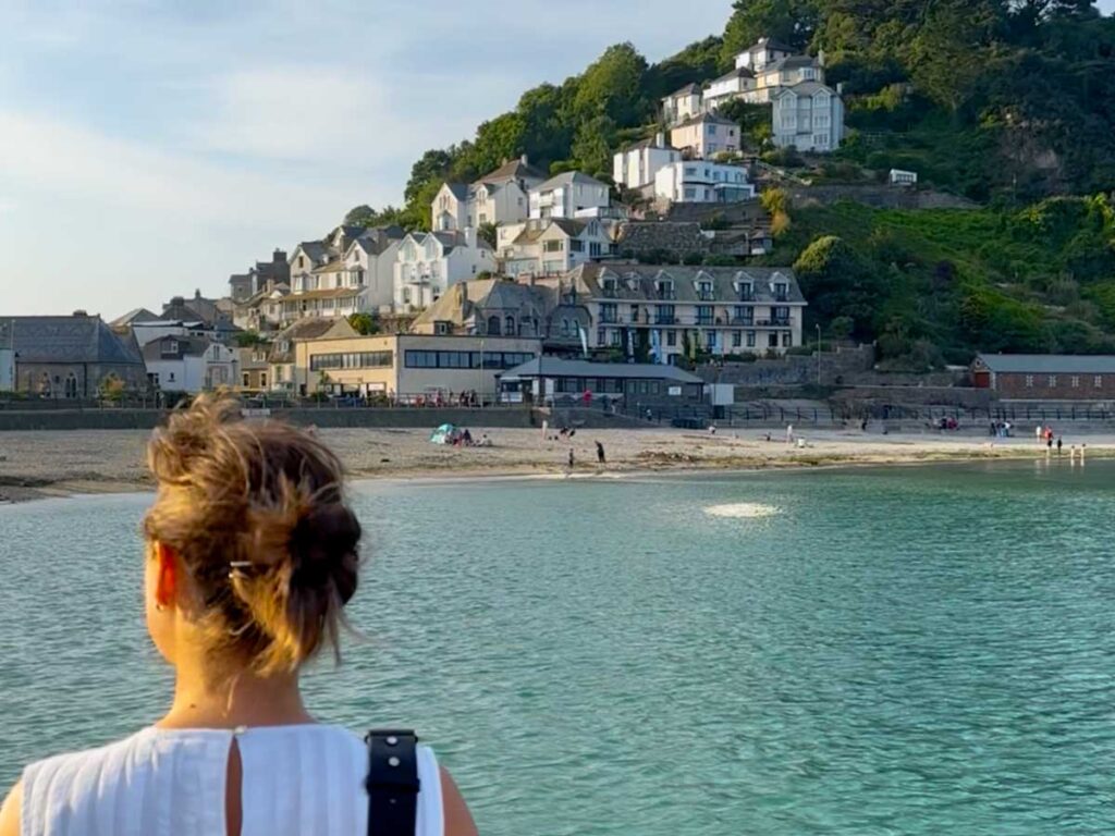 Woman looking at East Looe beach