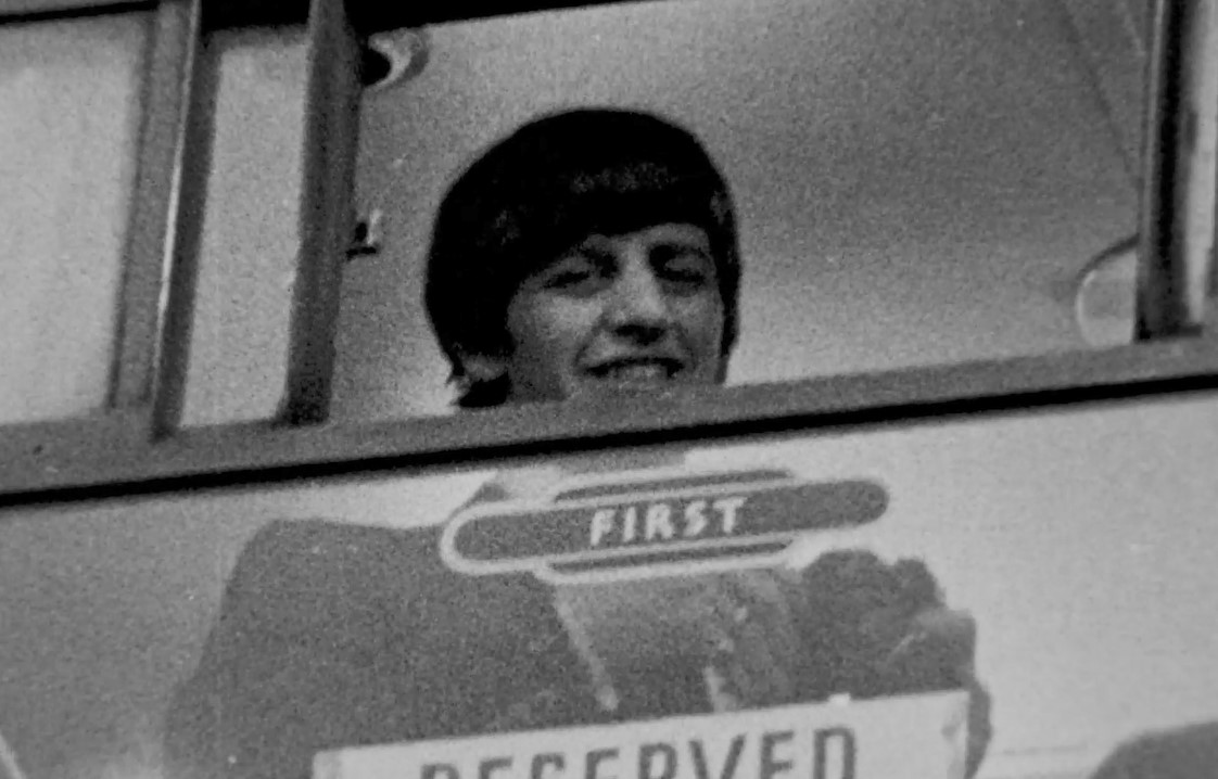 Ringo Starr looks out from train's First Class carriage